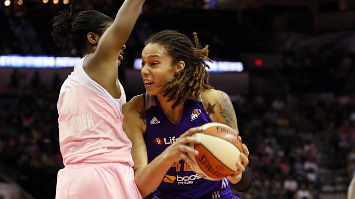Aug 17, 2013; San Antonio, TX, USA; Phoenix Mercury player  Brittney Griner (right) shoots against San Antonio Silver Stars center  Kayla Alexander (left) during the first half at the AT&T Center. Mandatory Credit: Soobum Im-Imagn Images