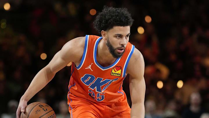 Dec 14, 2024; Las Vegas, Nevada, USA; Oklahoma City Thunder guard Ajay Mitchell (25) controls the ball against the Houston Rockets during the first half in a semifinal of the 2024 Emirates NBA Cup at T-Mobile Arena. Mandatory Credit: Kyle Terada-Imagn Images Dec 14, 2024; Las Vegas, Nevada, USA; Oklahoma City Thunder guard Ajay Mitchell (25) controls the ball against the Houston Rockets during the first half in a semifinal of the 2024 Emirates NBA Cup at T-Mobile Arena. Mandatory Credit: Kyle Terada-Imagn Images