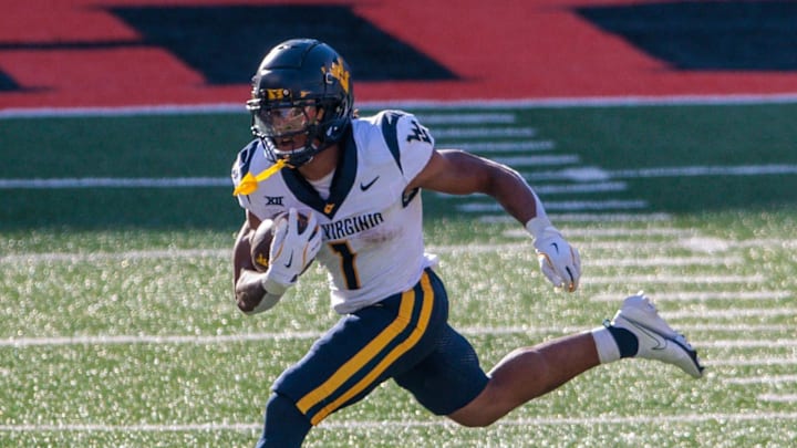 Oct 5, 2024; Stillwater, Oklahoma, USA; West Virginia Mountaineers running back Jahiem White (1) runs the ball against the Oklahoma State Cowboys during the third quarter at Boone Pickens Stadium. Mandatory Credit: William Purnell-Imagn Images Oct 5, 2024; Stillwater, Oklahoma, USA; West Virginia Mountaineers running back Jahiem White (1) runs the ball against the Oklahoma State Cowboys during the third quarter at Boone Pickens Stadium. Mandatory Credit: William Purnell-Imagn Images