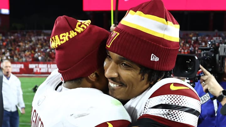 Jan 12, 2025; Tampa, Florida, USA; Washington Commanders quarterback Jayden Daniels (5) celebrates with linebacker Bobby Wagner (54) after winning a NFC wild card playoff against the Tampa Bay Buccaneers at Raymond James Stadium. Mandatory Credit: Kim Klement Neitzel-Imagn Images