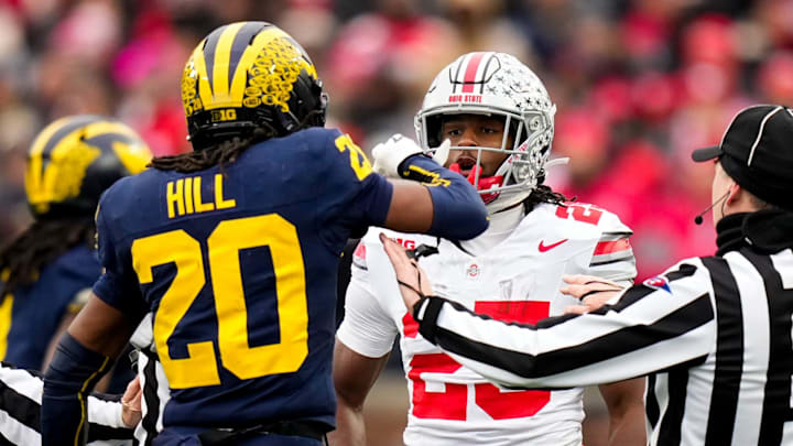 Michigan Wolverines defensive back Jyaire Hill (20) and Ohio State Buckeyes running back Bo Jackson (25) are separated in the first half in Ann Arbor, Michigan.