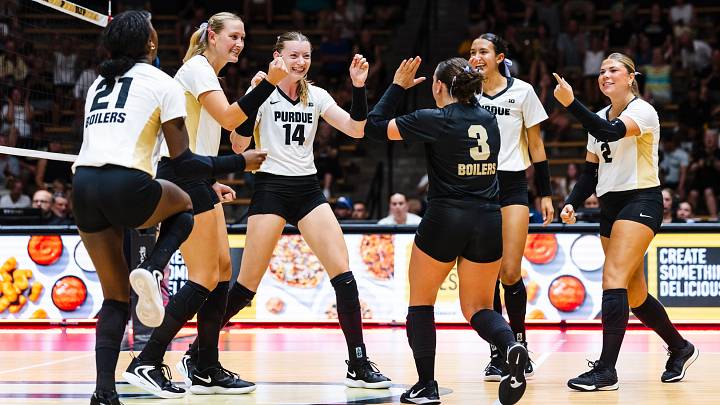 Purdue's volleyball team celebrates a win.