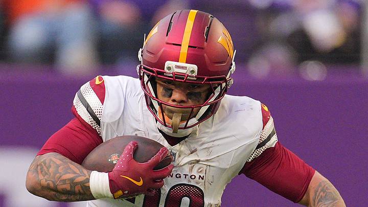 Dec 7, 2025; Minneapolis, Minnesota, USA; Washington Commanders running back Chris Rodriguez Jr. (36) rushes the ball against the Minnesota Vikings during the second half at U.S. Bank Stadium. 