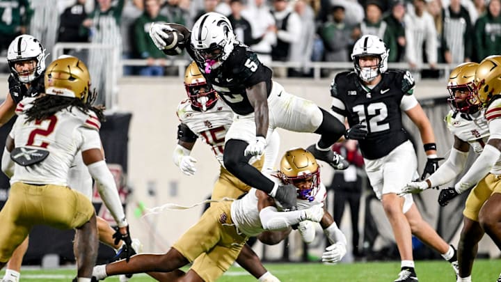 Michigan State's Makhi Frazier leaps over a Boston College's defender during the fourth quarter on Saturday, Sept. 6, 2025, at Spartan Stadium in East Lansing.
