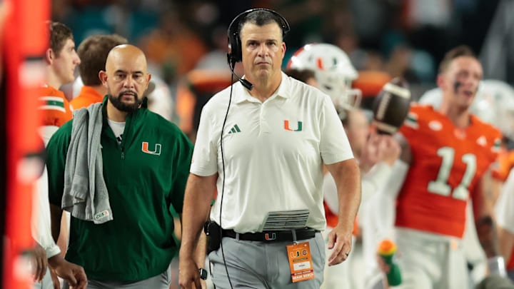Sep 6, 2025; Miami Gardens, Florida, USA; Miami Hurricanes head coach Mario Cristobal looks on from the sideline against the Bethune-Cookman Wildcats during the second quarter at Hard Rock Stadium. Mandatory Credit: Sam Navarro-Imagn Images