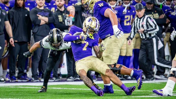 UW receiver Raiden Vines-Bright was injured on this play, struck by Purdue safety Myles Slusher (9). 
