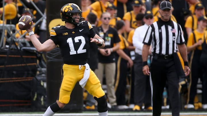 Iowa’s Cade McNamara (12) throws a pass against Troy Saturday, Sept. 14, 2024 at Kinnick Stadium in Iowa City, Iowa.