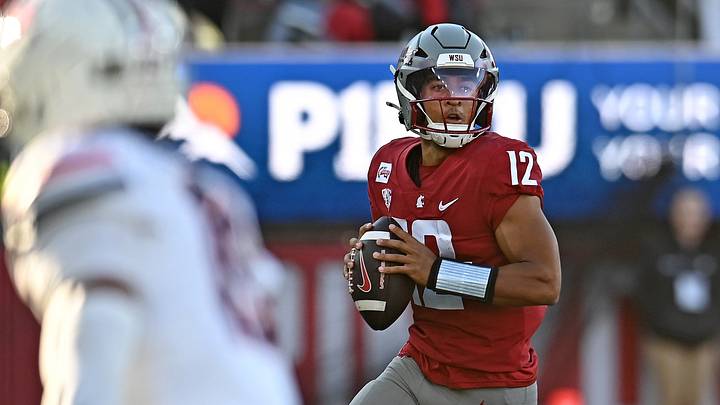 Washington State Cougars quarterback Caden Pinnick (12) rolls out against the Arizona Wildcats during the first half at Gesa Field at Martin Stadium. Washington State Cougars quarterback Caden Pinnick (12) rolls out against the Arizona Wildcats during the first half at Gesa Field at Martin Stadium.