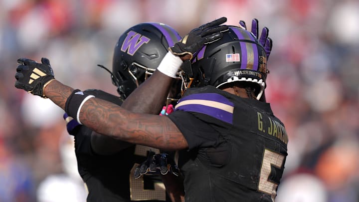Washington player Giles Jackson (5) at right celebrates his touchdown with Jason Robinson Jr. during their game against Louisville at the Tony the Tiger Sun Bowl game on Dec. 31, 2024.