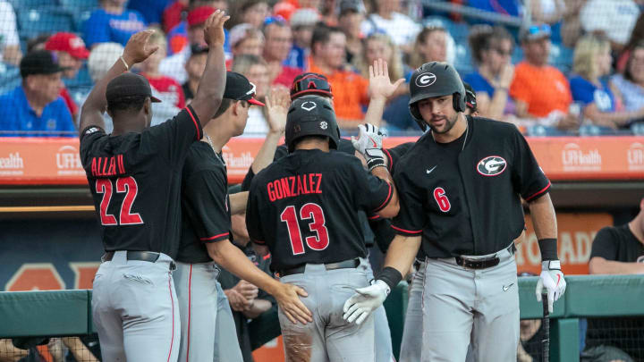 Georgia's catcher Fernando Gonzalez (13) scores a run on the Gators, Friday, April 14, 2023, at Condron Family Baseball Park in Gainesville, Florida. The Gators lost Game 1 of the weekend series to the Bulldogs 13-11. [Cyndi Chambers/ Gainesville Sun] 2023

Gator Baseball April 14 2023 Condron Family Ballpark Georgia Bulldogs