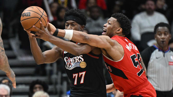 Jan 11, 2026; Toronto, Ontario, CAN;  Toronto Raptors guard Alijah Martin (55) forces a turnover by knocking the ball from the grasp of Philadelphia 76ers guard VJ Edgecombe (77) in the second half at Scotiabank Arena.