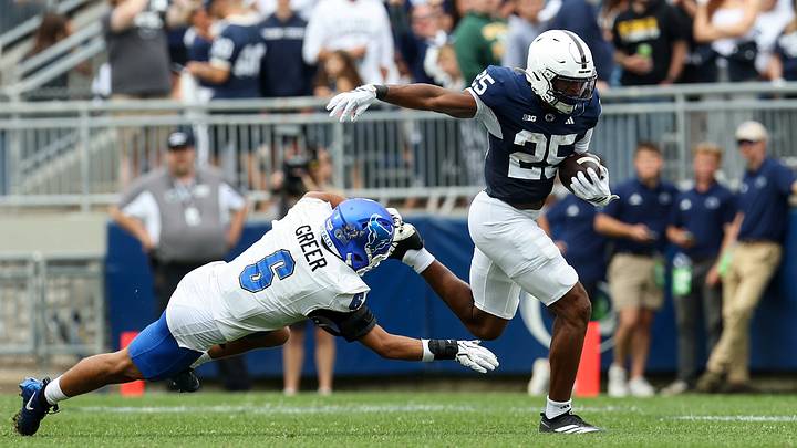 Penn State Nittany Lions running back Quinton Martin Jr. (25) runs with the ball while avoiding a tackle from Buffalo Bulls safety Miles Greer (6) during the first quarter at Beaver Stadium. Penn State Nittany Lions running back Quinton Martin Jr. (25) runs with the ball while avoiding a tackle from Buffalo Bulls safety Miles Greer (6) during the first quarter at Beaver Stadium.