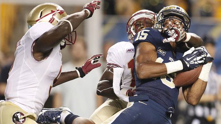 Sep 2, 2013; Pittsburgh, PA, USA; Pittsburgh Panthers wide receiver Devin Street (15) catches a pass against Florida State Seminoles defensive back Karlos Williams (left) and cornerback Nick Waisome (middle) during the fourth quarter at Heinz Field. The Florida State Seminoles won 41-13. Mandatory Credit: Charles LeClaire-Imagn Images