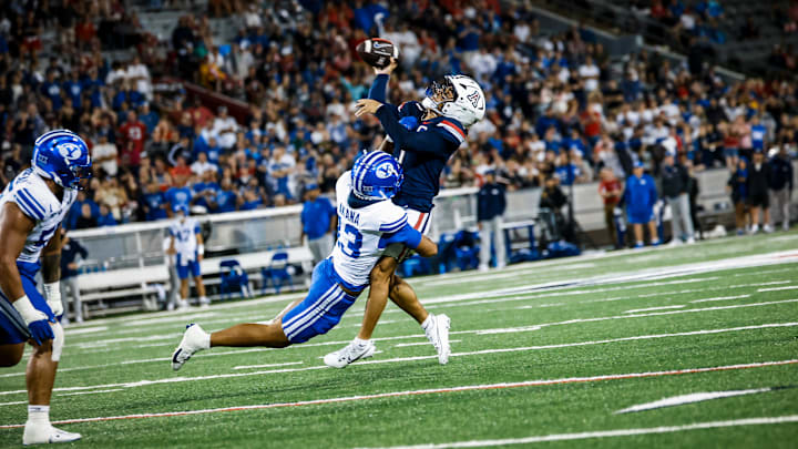 BYU defensive end Tausili Akana pressures Noah Fifita in Cougars' win over Arizona