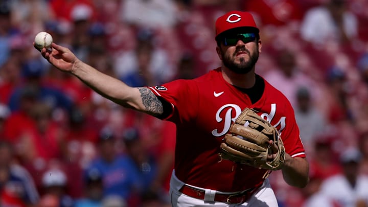 Cincinnati Reds infielder Mike Moustakas throws the ball.