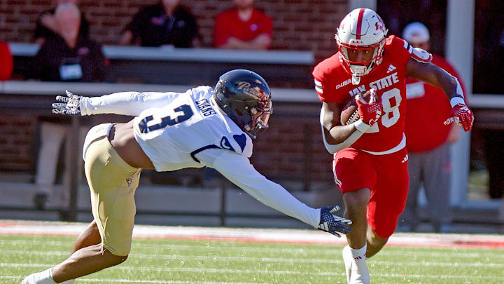 Jacksonville State's Tre Stewart tries to evade the tackle of FIU's JoJo Evans during college football action at AmFirst Stadium in Jacksonville, Alabama November 16, 2024. (Dave Hyatt / Hyatt Media LLC)