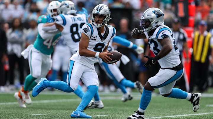 Oct 5, 2025; Charlotte, North Carolina, USA; Carolina Panthers quarterback Bryce Young (9) fakes a hand off during the fourth quarter against the Miami Dolphins at Bank of America Stadium.
