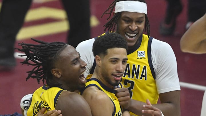 Indiana Pacers guard Tyrese Haliburton celebrates with forward Aaron Nesmith and center Myles Turner.