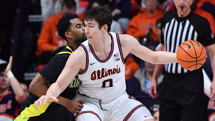 Mar 3, 2026; Champaign, Illinois, USA; Illinois Fighting Illini forward David Mirkovic (0) drives against Oregon Ducks forward Sean Stewart (13) during the second half at State Farm Center. Mandatory Credit: Ron Johnson-Imagn Images Mar 3, 2026; Champaign, Illinois, USA; Illinois Fighting Illini forward David Mirkovic (0) drives against Oregon Ducks forward Sean Stewart (13) during the second half at State Farm Center. Mandatory Credit: Ron Johnson-Imagn Images