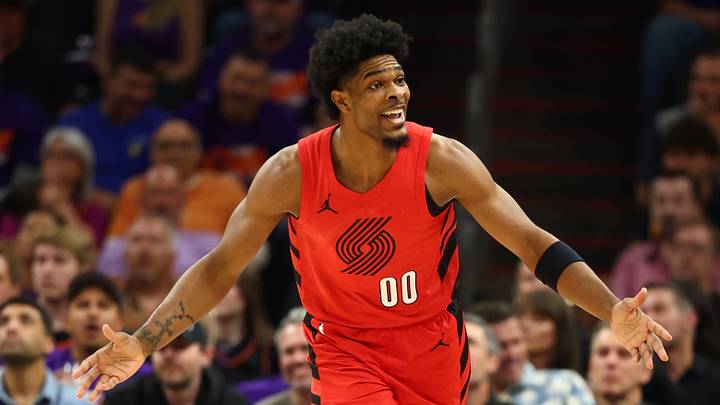 Apr 14, 2026; Phoenix, Arizona, USA; Portland Trail Blazers guard Scoot Henderson (00) reacts against the Phoenix Suns in the first half during the play-in rounds of the 2026 NBA Playoffs at Mortgage Matchup Center. Mandatory Credit: Mark J. Rebilas-Imagn Images Apr 14, 2026; Phoenix, Arizona, USA; Portland Trail Blazers guard Scoot Henderson (00) reacts against the Phoenix Suns in the first half during the play-in rounds of the 2026 NBA Playoffs at Mortgage Matchup Center. Mandatory Credit: Mark J. Rebilas-Imagn Images