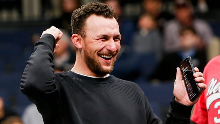 Former Texas A&M Heisman Trophy-winning quarterback Johnny Manziel cheers on the Aggies during the first round game between Texas A&M and Nebraska in the 2024 NCAA Tournament at FedExForum in Memphis, Tenn., on Friday, March 22, 2024.