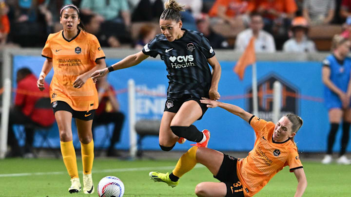 Washington Spirit forward Trinity Rodman (2) is tackled by Houston Dash midfielder Elin Rubensson (31) during the second half at Shell Energy Stadium 