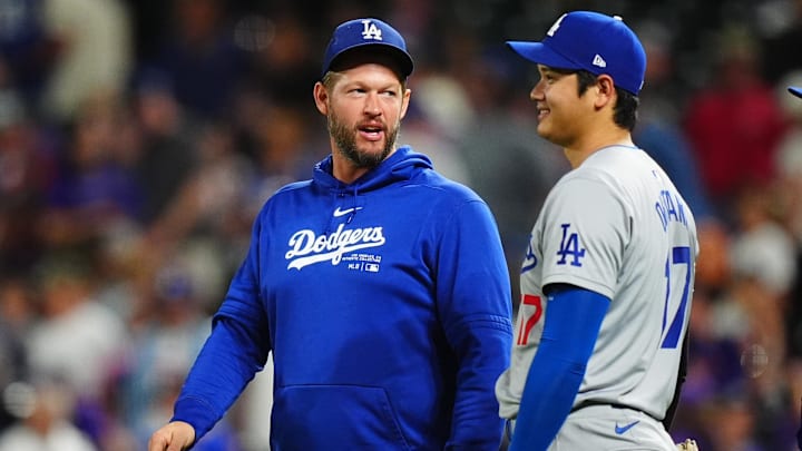 Sep 28, 2024; Denver, Colorado, USA; Los Angeles Dodgers pitcher Clayton Kershaw (22) and designated hitter Shohei Ohtani (17) celebrate defeating the Colorado Rockies at Coors Field. Mandatory Credit: Ron Chenoy-Imagn Images