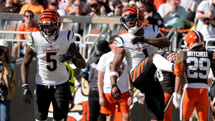Cincinnati Bengals wide receiver Tee Higgins (5) and Bengals wide receiver Ja'Marr Chase (1) celebrate Chase touchdown in the 3rd quarter over the Cleveland Browns in the NFL Week 7 game at Huntington Bank Field in Cleveland October 20, 2024. The Bengals won 21-14.. Cincinnati Bengals wide receiver Tee Higgins (5) and Bengals wide receiver Ja'Marr Chase (1) celebrate Chase touchdown in the 3rd quarter over the Cleveland Browns in the NFL Week 7 game at Huntington Bank Field in Cleveland October 20, 2024. The Bengals won 21-14..