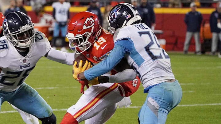 Nov 6, 2022; Kansas City, Missouri, USA; Kansas City Chiefs wide receiver Kadarius Toney (19) runs the ball as Tennessee Titans cornerback Kristian Fulton (26) makes the tackle during the second half of the game at GEHA Field at Arrowhead Stadium. Mandatory Credit: Denny Medley-Imagn Images