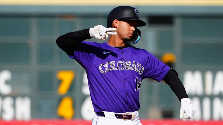 Denver, Colorado, USA; Colorado Rockies shortstop Ezequiel Tovar (14) celebrates his two run double in the ninth inning against the St. Louis Cardinals at Coors Field.