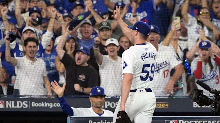 Oct 11, 2024; Los Angeles, California, USA; Los Angeles Dodgers pitcher Evan Phillips (59) reacts after being relieved in the seventh inning against the San Diego Padres during game five of the NLDS for the 2024 MLB Playoffs at Dodger Stadium. Mandatory Credit: Jayne Kamin-Oncea-Imagn Images Oct 11, 2024; Los Angeles, California, USA; Los Angeles Dodgers pitcher Evan Phillips (59) reacts after being relieved in the seventh inning against the San Diego Padres during game five of the NLDS for the 2024 MLB Playoffs at Dodger Stadium. Mandatory Credit: Jayne Kamin-Oncea-Imagn Images