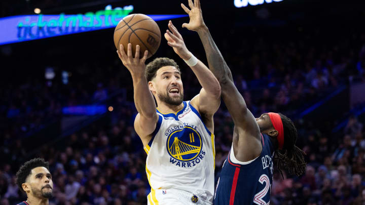 Feb 7, 2024; Philadelphia, Pennsylvania, USA; Golden State Warriors guard Klay Thompson (11) scores past Philadelphia 76ers guard Patrick Beverley (22) during the third quarter at Wells Fargo Center. Mandatory Credit: Bill Streicher-USA TODAY Sports Feb 7, 2024; Philadelphia, Pennsylvania, USA; Golden State Warriors guard Klay Thompson (11) scores past Philadelphia 76ers guard Patrick Beverley (22) during the third quarter at Wells Fargo Center. Mandatory Credit: Bill Streicher-USA TODAY Sports