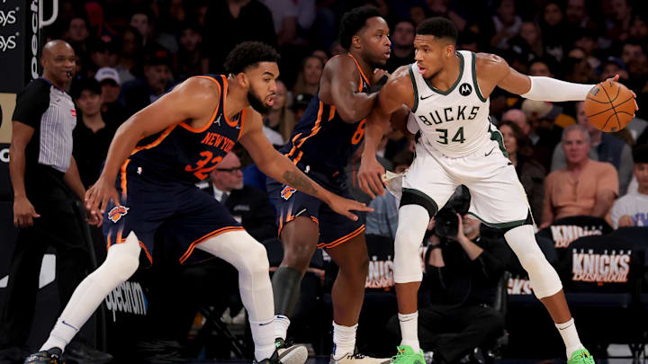 Nov 8, 2024; New York, New York, USA; Milwaukee Bucks forward Giannis Antetokounmpo (34) controls the ball against New York Knicks forward OG Anunoby (8) and center Karl-Anthony Towns (32) during the third quarter at Madison Square Garden. Mandatory Credit: Brad Penner-Imagn Images