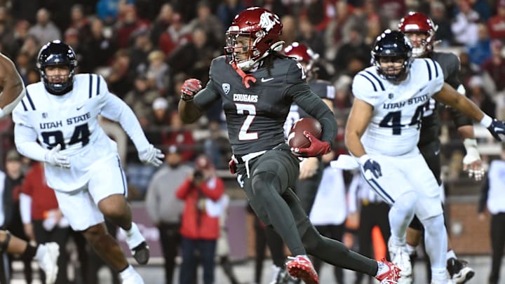 Nov 9, 2024; Pullman, Washington, USA; Washington State Cougars wide receiver Kyle Williams (2) runs the ball against the Utah State Aggies in the first half at Gesa Field at Martin Stadium. Mandatory Credit: James Snook-Imagn Images