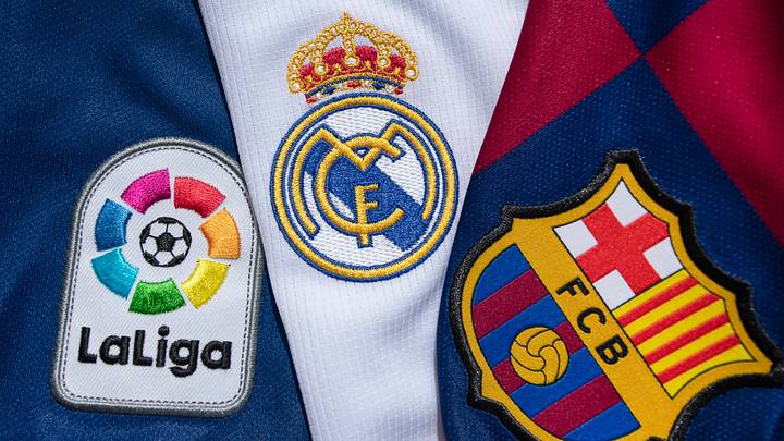 The FC Barcelona and Real Madrid Club Badges with the Lal Liga Logo The FC Barcelona and Real Madrid Club Badges with the Lal Liga Logo