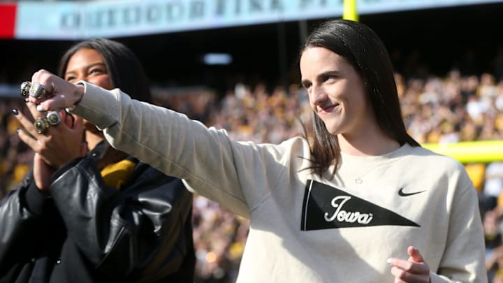 Iowa women’s basketball’s Caitlin Clark shows off her rings during a second quarter timeout during Iowa football’s game against Northwestern Saturday, Oct. 26, 2024 at Kinnick Stadium in Iowa City, Iowa.