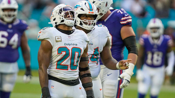Miami Dolphins linebacker Jordyn Brooks (20) and defensive tackle Jordan Phillips (94) celebrate a fourth down stop against the Buffalo Bills during the fourth quarter at Hard Rock Stadium. Miami Dolphins linebacker Jordyn Brooks (20) and defensive tackle Jordan Phillips (94) celebrate a fourth down stop against the Buffalo Bills during the fourth quarter at Hard Rock Stadium.