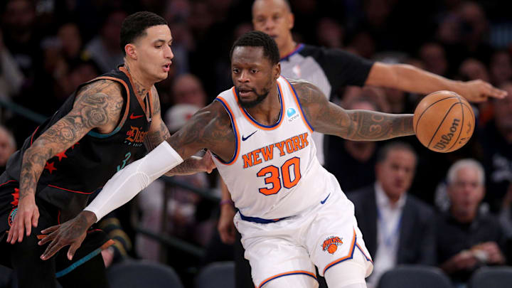 Jan 18, 2024; New York, New York, USA; New York Knicks forward Julius Randle (30) controls the ball against Washington Wizards forward Kyle Kuzma (33) during the third quarter at Madison Square Garden.