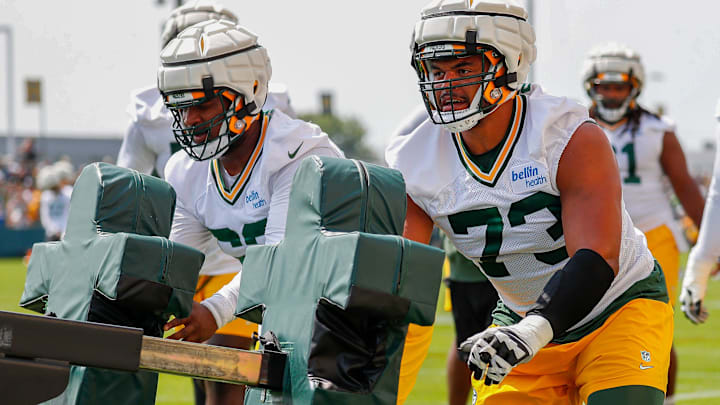 Green Bay Packers offensive linemen Jacob Monk (62) and Andre Dillard (73) run through a drill on Friday, July 26, 2024, at Ray Nitschke Field in Ashwaubenon, Wis.