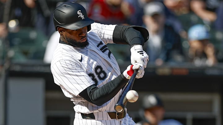 May 24, 2025; Chicago, Illinois, USA; Chicago White Sox center fielder Luis Robert Jr. (88) doubles against the Texas Rangers during the fourth inning at Rate Field. Mandatory Credit: Kamil Krzaczynski-Imagn Images