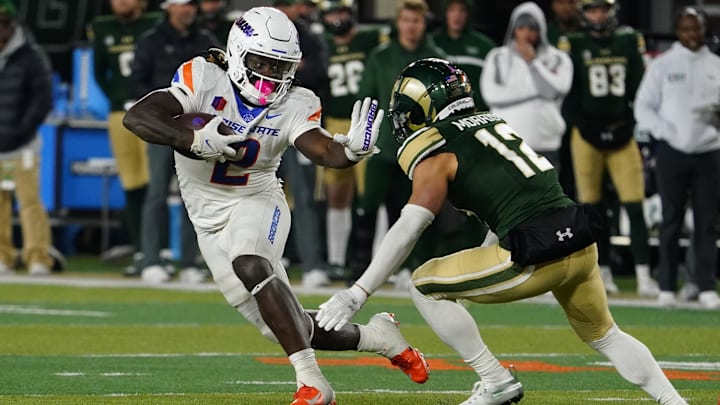 Oct 14, 2023; Fort Collins, Colorado, USA; Boise State Broncos running back Ashton Jeanty (2) tried to avoid Colorado State Rams defensive back Dominic Morris (12) at Sonny Lubick Field at Canvas Stadium. Oct 14, 2023; Fort Collins, Colorado, USA; Boise State Broncos running back Ashton Jeanty (2) tried to avoid Colorado State Rams defensive back Dominic Morris (12) at Sonny Lubick Field at Canvas Stadium.