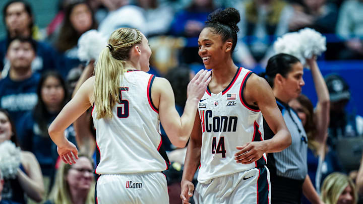 Dec 16, 2023; Hartford, Connecticut, USA; UConn Huskies guard Aubrey Griffin (44) reacts with guard Paige Bueckers (5) after a play against the Louisville Cardinals in the second half at XL Center. Mandatory Credit: David Butler II-Imagn Images Dec 16, 2023; Hartford, Connecticut, USA; UConn Huskies guard Aubrey Griffin (44) reacts with guard Paige Bueckers (5) after a play against the Louisville Cardinals in the second half at XL Center. Mandatory Credit: David Butler II-Imagn Images
