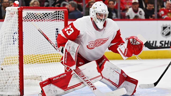 Oct 1, 2022; Chicago, Illinois, USA;  Detroit Red Wings goaltender Sebastian Cossa (33) defends the net against the Chicago Blackhawks at United Center. Mandatory Credit: Jamie Sabau-Imagn Images