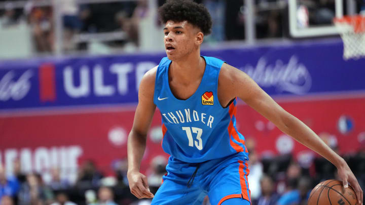 Jul 9, 2022; Las Vegas, NV, USA; Oklahoma City Thunder forward Ousmane Dieng (13) dribbles against the Houston Rockets during an NBA Summer League at Thomas & Mack Center. Mandatory Credit: Stephen R. Sylvanie-USA TODAY Sports Jul 9, 2022; Las Vegas, NV, USA; Oklahoma City Thunder forward Ousmane Dieng (13) dribbles against the Houston Rockets during an NBA Summer League at Thomas & Mack Center. Mandatory Credit: Stephen R. Sylvanie-USA TODAY Sports