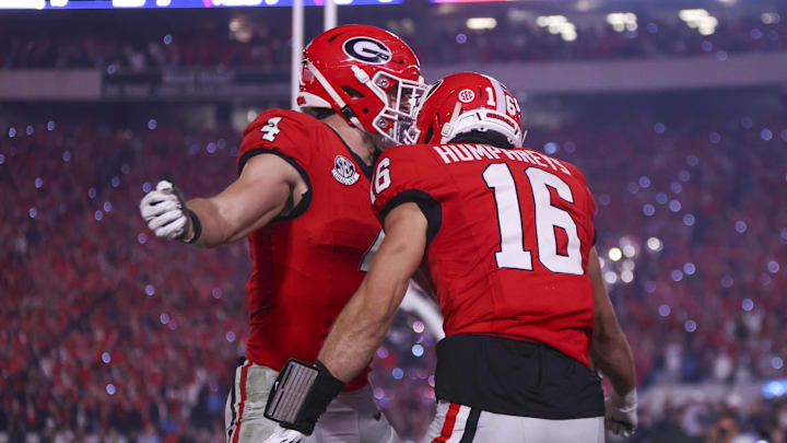 Nov 15, 2025; Athens, Georgia, USA; Georgia Bulldogs tight end Oscar Delp (4) and wide receiver London Humphreys (16) celebrate scoring a touchdown in the second half against the Texas Longhorns at Sanford Stadium. Mandatory Credit: Brett Davis-Imagn Images