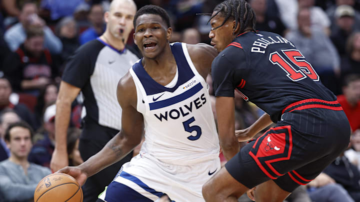 Nov 7, 2024; Chicago, Illinois, USA; Minnesota Timberwolves guard Anthony Edwards (5) drives to the basket against Chicago Bulls forward Julian Phillips (15) during the first half at United Center. Mandatory Credit: Kamil Krzaczynski-Imagn Images