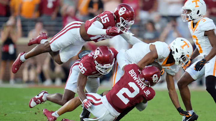 Oklahoma Sooners defensive back Kendel Dolby (15), defensive back Kani Walker (26) and defensive back Billy Bowman Jr. (2) bring down Tennessee Volunteers wide receiver Chris Brazzell II (17) during a college football game between the University of Oklahoma Sooners (OU) and the Tennessee Volunteers at Gaylord Family - Oklahoma Memorial Stadium in Norman, Okla., Saturday, Sept. 21, 2024.
