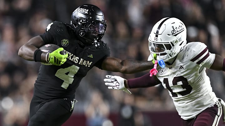Oct 4, 2025; College Station, Texas, USA; Texas A&M Aggies running back Rueben Owens II (4) stiff arms Mississippi State Bulldogs safety Jahron Manning (13) during the fourth quarter at Kyle Field. Mandatory Credit: Maria Lysaker-Imagn Images 
