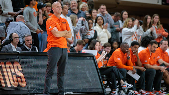 Nov 4, 2025; Stillwater, Oklahoma, USA; Oklahoma State Cowboys coach Steve Lutz watches game play during the first half against the Oral Roberts Golden Eagles at Gallagher-Iba Arena. Mandatory Credit: William Purnell-Imagn Images