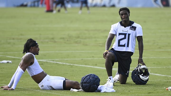 Jul 24, 2025; Nashville, TN, USA;  Tennessee Titans cornerback Roger McCreary (21) and running back Jordan Mims (24) hang out on the field during training camp at Ascension Saint Thomas Sports Park. Mandatory Credit: Steve Roberts-Imagn Images